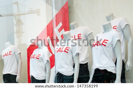 window display with text SALE in a shop