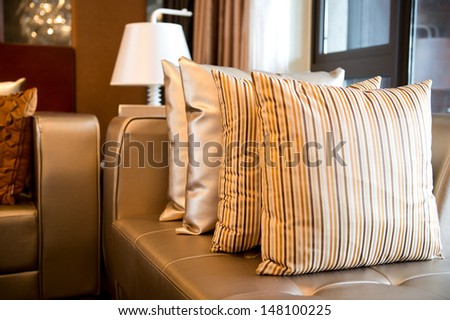 Comfortable Corner In Family Room, With Many Pillows.