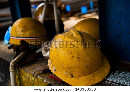 Some construction helmets on work place.
