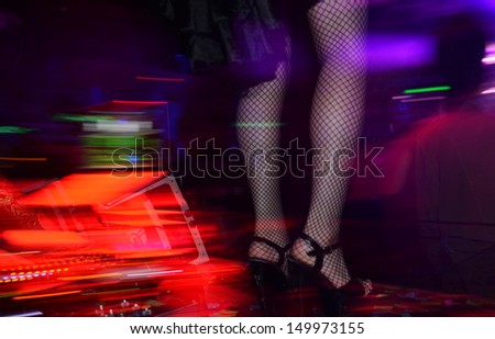 Woman dancing in the nightclub.