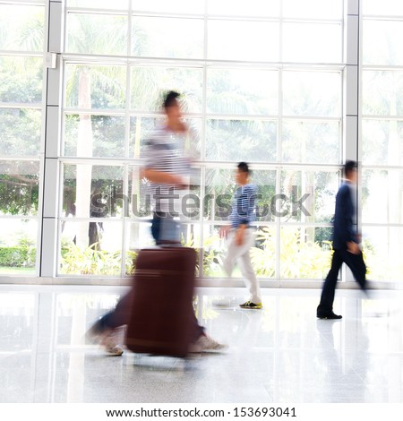 Business people rushing in the lobby. motion blur