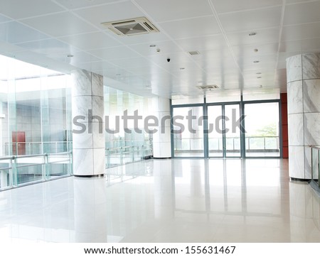 Empty Long Corridor In The Modern Office Building.