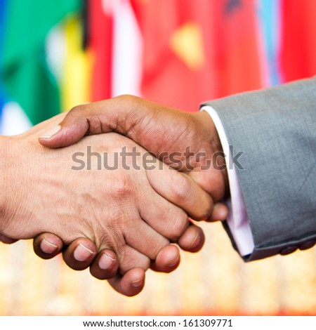 African businessman's hand shaking white businessman's hand  making a business deal.