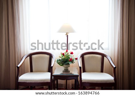 Two Armchairs And Table In The Room For Rest.