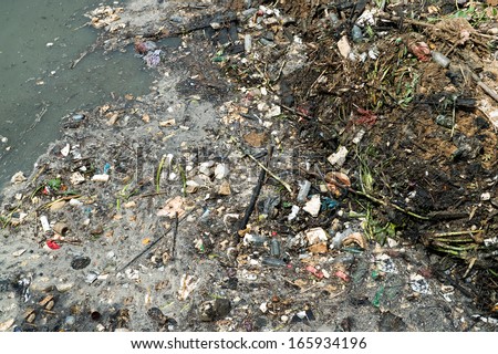 Water pollution in river with trash.
