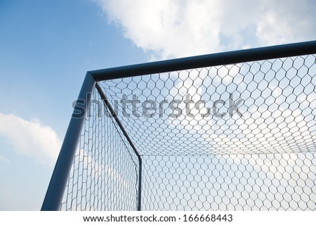 soccer goal against cloudy sky background.