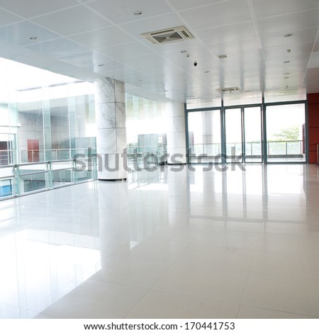 Empty Long Corridor In The Modern Office Building.