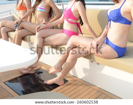 Four asian women relaxing in cruise
