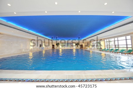 Luxury indoor swimming pool with beautiful clean blue water.
