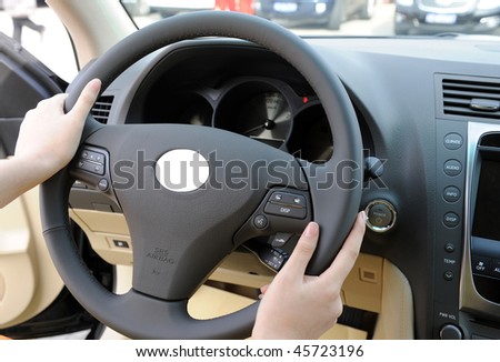 Hold the steering wheel with both hands