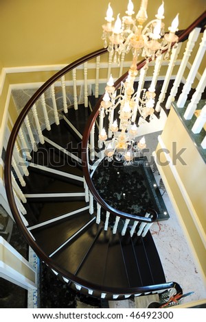 Shot from above, looking down a spiral stair case covered