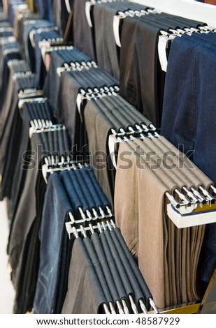 trousers on hangers at the show, for sale