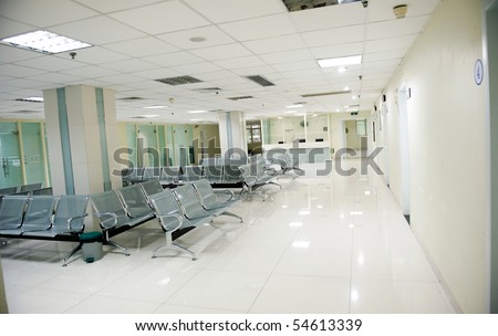 Hospital waiting room with empty chairs.