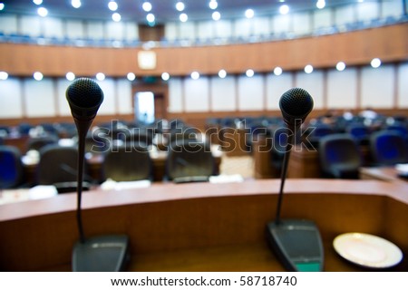 before a conference the microphones in front of empty chairs. before a conference the microphones in front of empty chairs.