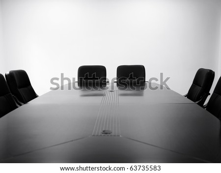 Meeting room with table and chairs. black and white