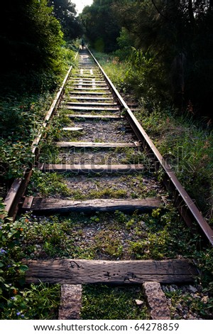 Old railway track in the forest, China.