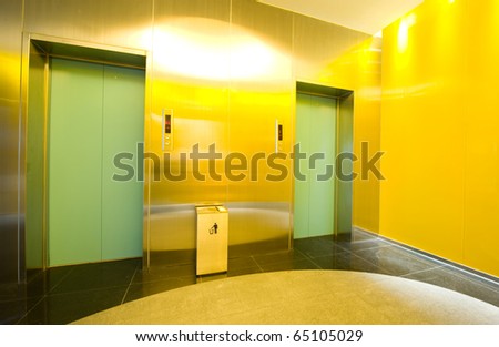 Two lifts in a modern business building.