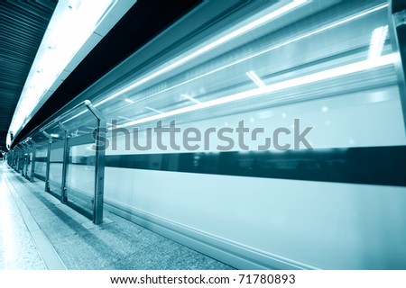 high speed moving train in subway station. Black & white image