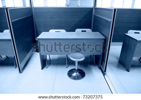 Chair and table in a office, blue tone.