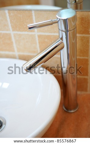Modern style chrome bathroom tap in modern bathroom.