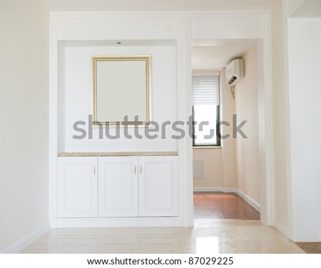 Empty home interior , hardwood floors and moulding details.