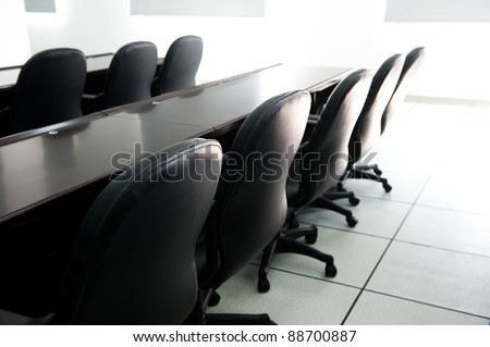 Head office boardroom with leather chairs.
