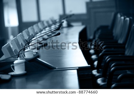 boardroom with chairs and intercom system