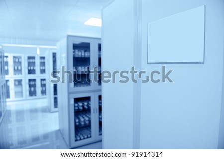 Lab interior with many cabinets with bottles.
