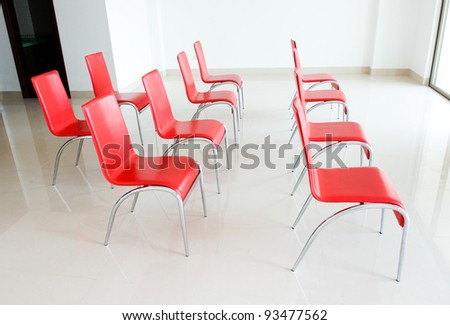 red chairs in ordinary empty waiting room.