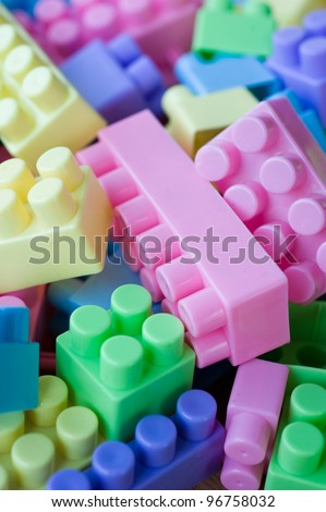 Close up of colorful plastic toy bricks.