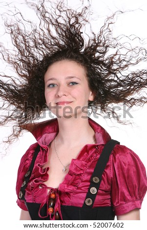 The young girl with the hair lifted by a wind is shown on a white background