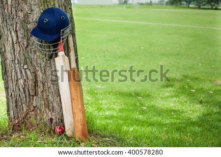 Cricket Equipment at cricket field,showcasing bats, balls, helmets and pads