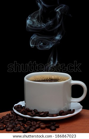 Perfect Coffee. cup of coffee, coffee beans and smoke