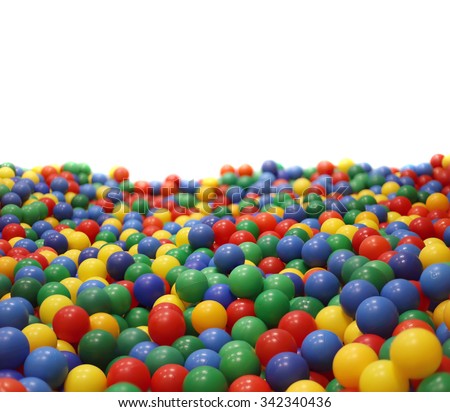 Multi-colored plastic balls. A  children\'s playroom.  isolated on  white background.