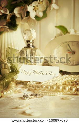 Note card with jewelry and flowers for mother\'s day