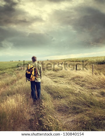Man walking down country road on the prairies