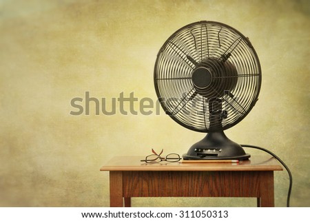 Old electric fan on table with retro look feeling