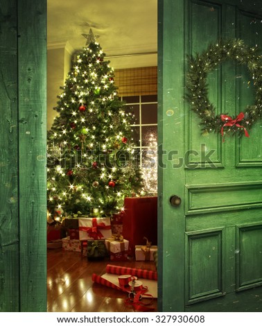 Rustic door opening into a room decorated for Christmas
