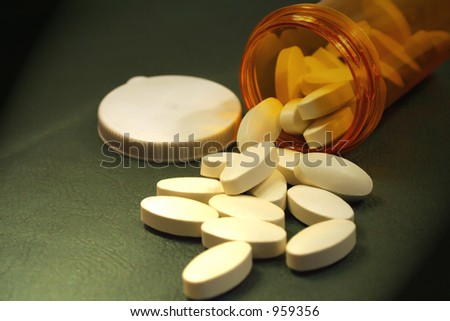 Medical concept/Pills spill from bottle