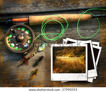 Fly fishing rod with instant photo pictures on wood background