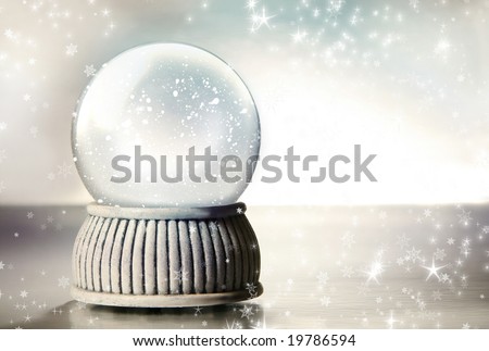 Snow globe against a silver background Snow globe against a silver background