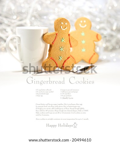 Hot holiday drink with gingerbread cookies on festive cookie recipe