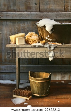 Old wash tub with soap and scrub brushes