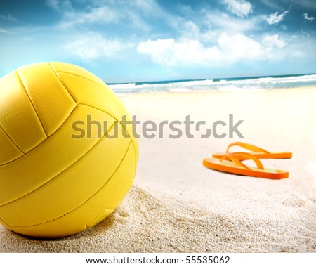 Volleyball in the sand with sandals at the beach