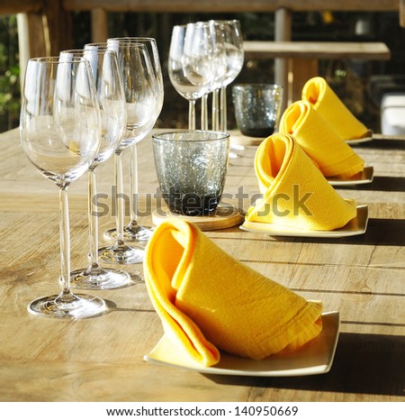Table Setting - Fine restaurant dinner table place setting - napkin & wineglass