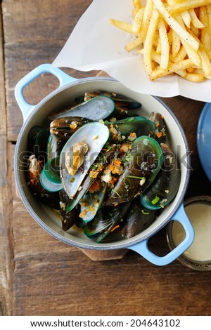 green mussels baked with cheese and french fries