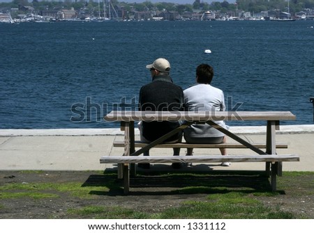 couple sitting at picnic table enjoying scenery