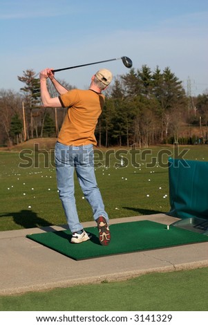 golfer at driving range