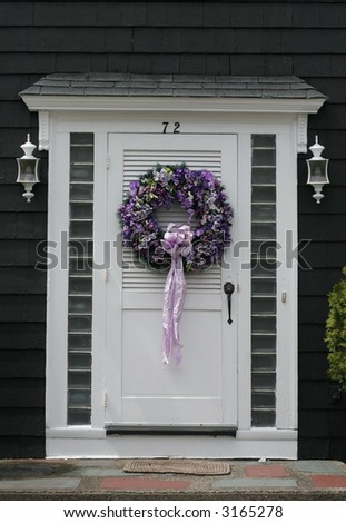 beautiful purple wreath on white door
