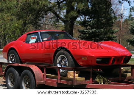 red corvette on trailer